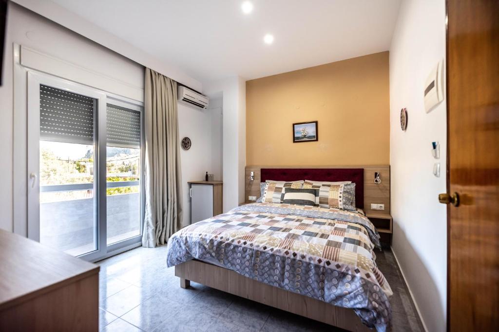 Łóżko lub łóżka w pokoju w obiekcie Hotel Dimitra Sun