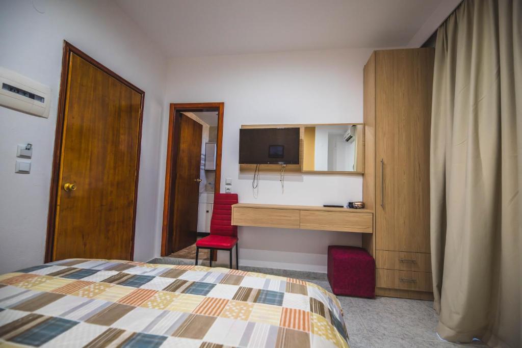 Łóżko lub łóżka w pokoju w obiekcie Hotel Dimitra Sun