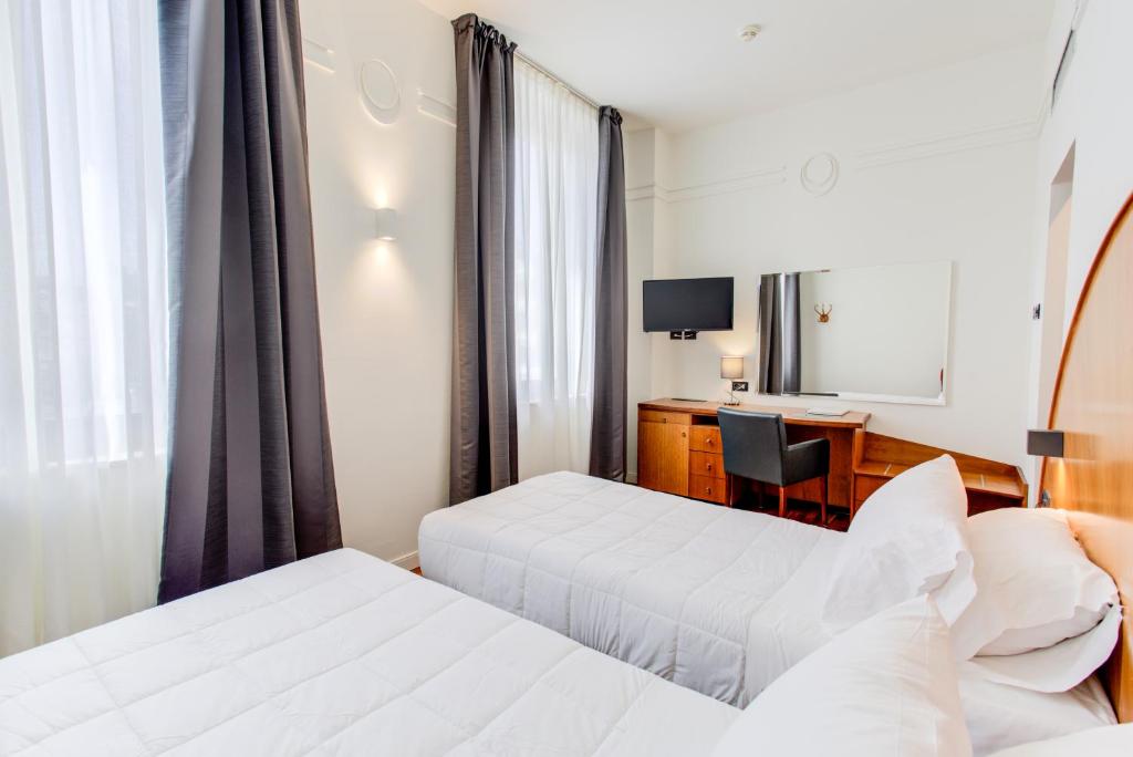 Кровать или кровати в номере Kursaal Hotel