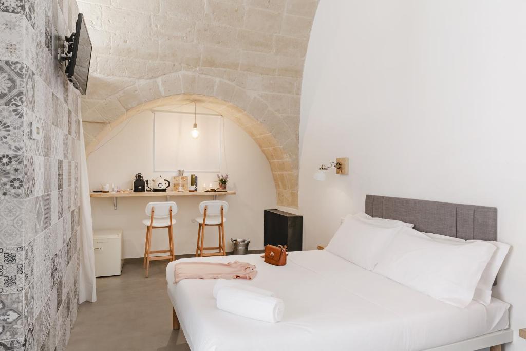 Postel nebo postele na pokoji v ubytování Hydria Rooms