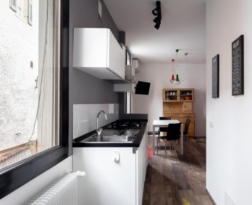 a small kitchen with a sink and a stove at Appartamento Vo' 74 in Trento