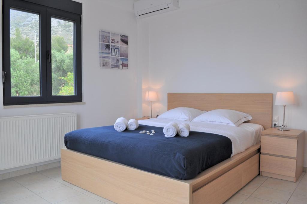 A bed or beds in a room at Nefeli Villas