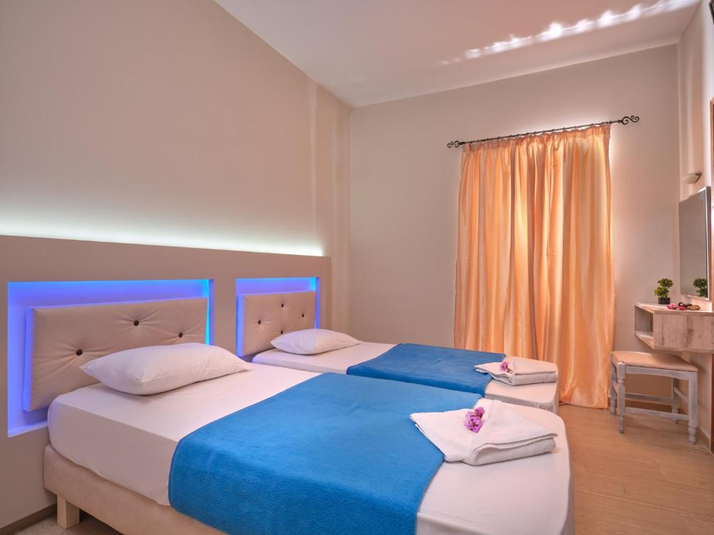 Postel nebo postele na pokoji v ubytování Savvas Hotel