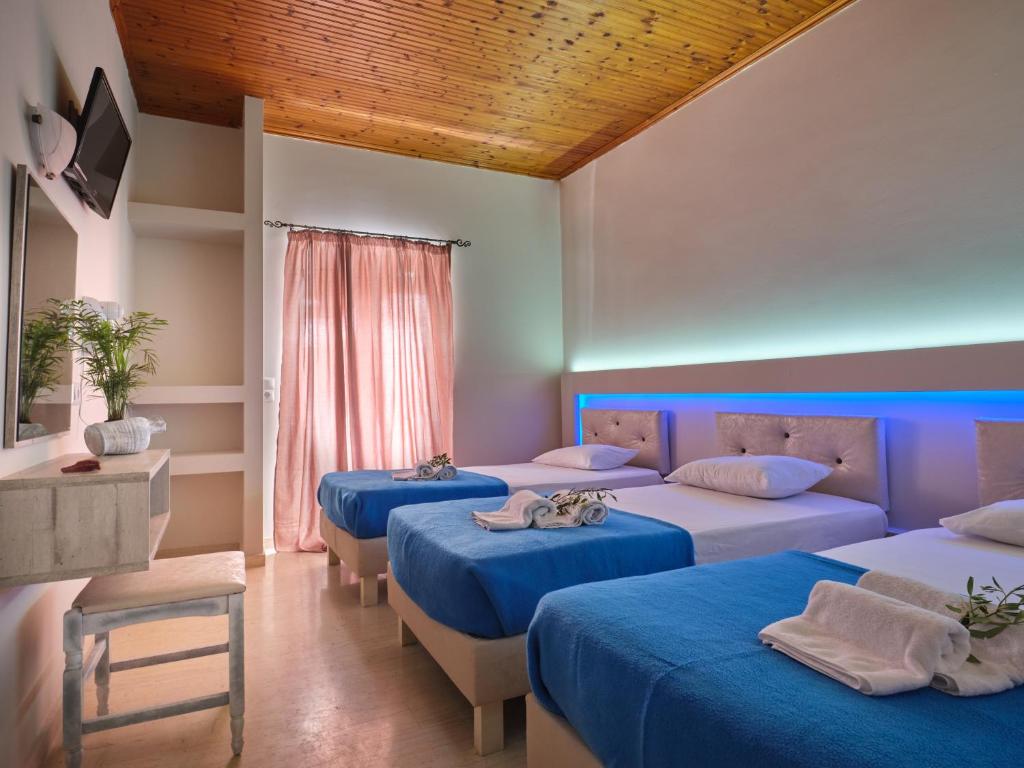Postel nebo postele na pokoji v ubytování Savvas Hotel