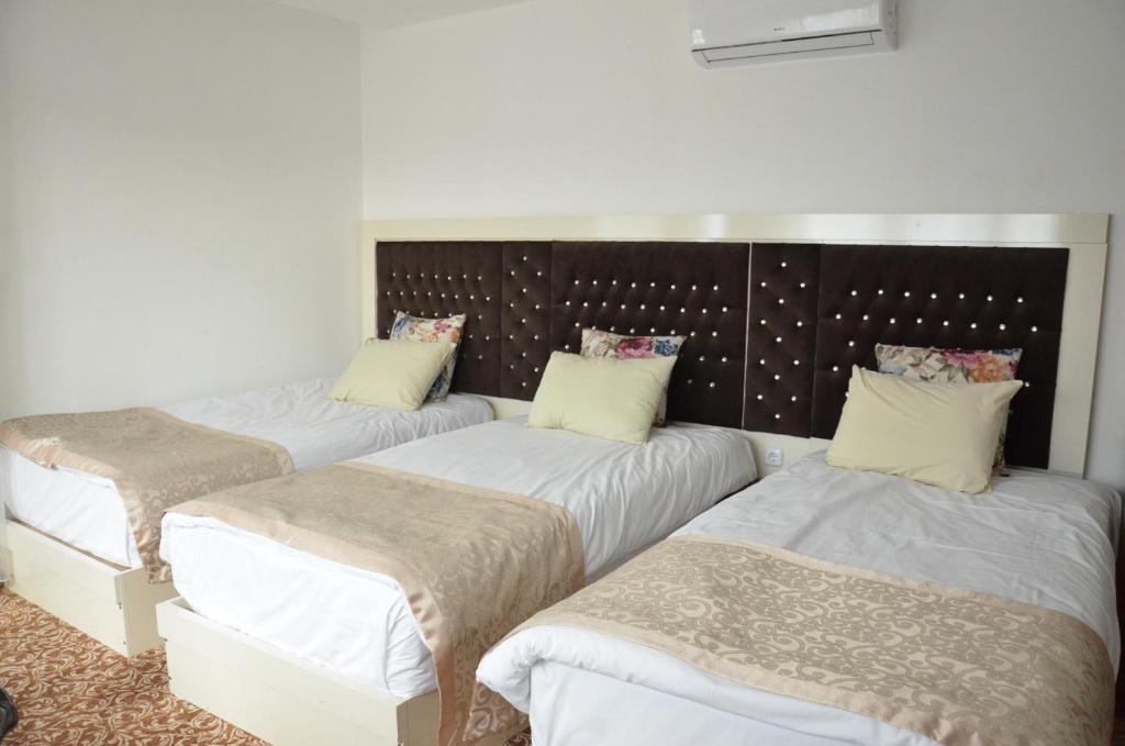 Postel nebo postele na pokoji v ubytování New Hotel