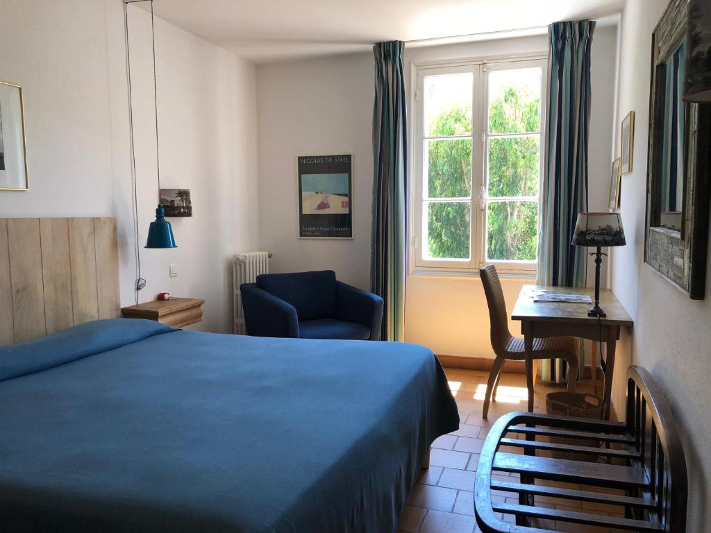 Postel nebo postele na pokoji v ubytování Le Manoir de Port-Cros