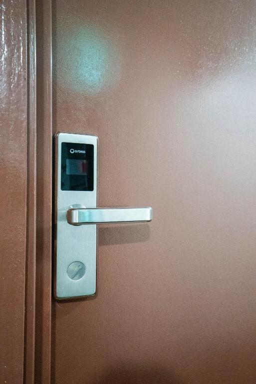 a close up of a door with a handle at Crystal Garden Hotel (Tasik Selatan) in Kuala Lumpur