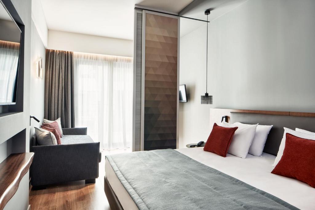 Postel nebo postele na pokoji v ubytování Hotel Achilleas