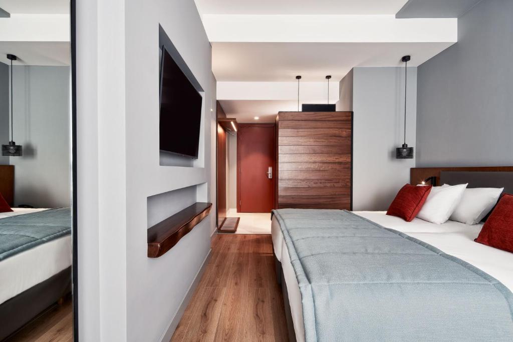 Postel nebo postele na pokoji v ubytování Hotel Achilleas