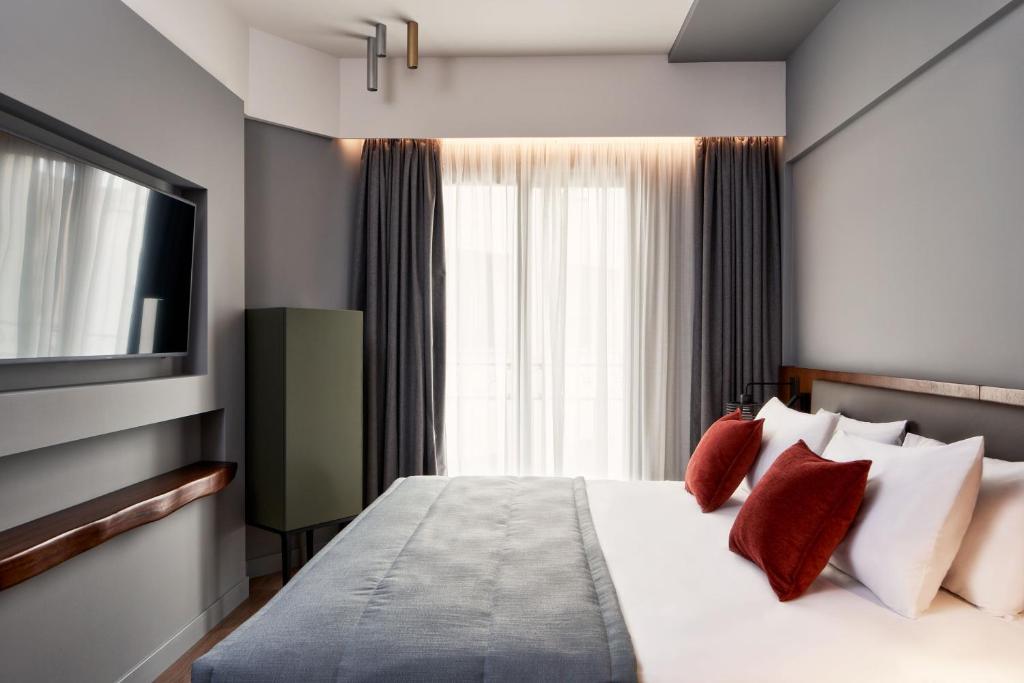 Postel nebo postele na pokoji v ubytování Hotel Achilleas