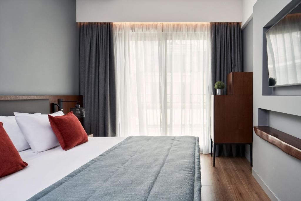 Postel nebo postele na pokoji v ubytování Hotel Achilleas