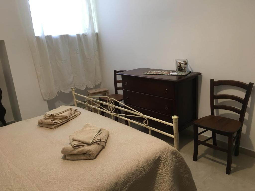 Postel nebo postele na pokoji v ubytování B&B Domus Gaetani