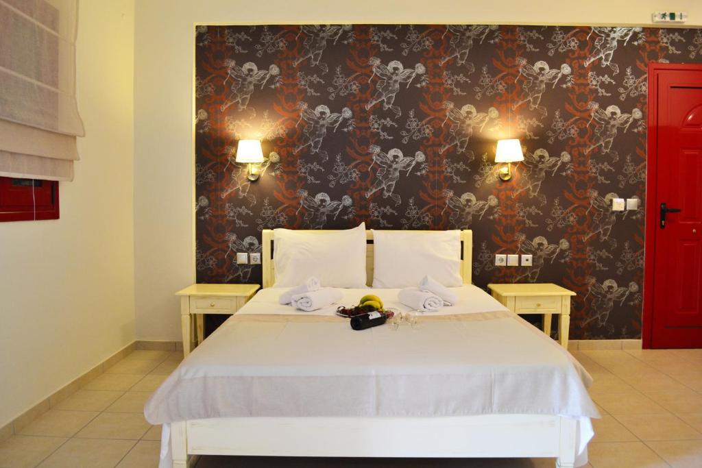 Postel nebo postele na pokoji v ubytování Michaelangelo Boutique Parga