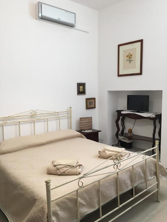 Postel nebo postele na pokoji v ubytování B&B Domus Gaetani