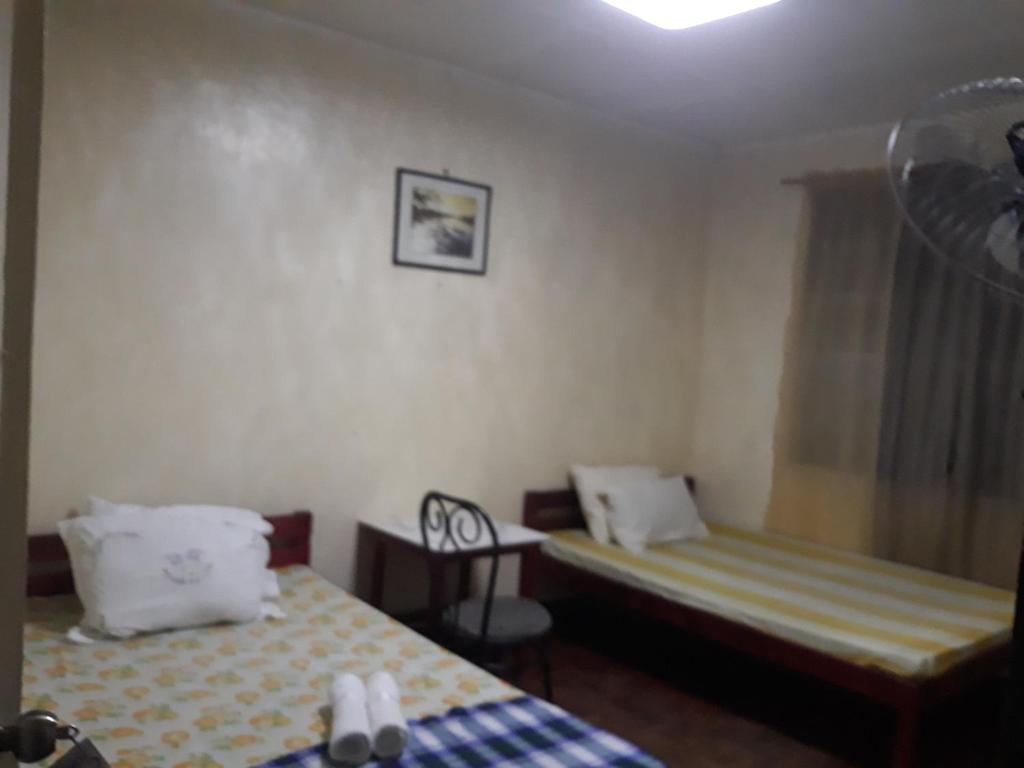 Postel nebo postele na pokoji v ubytování cv bed n bath san juan