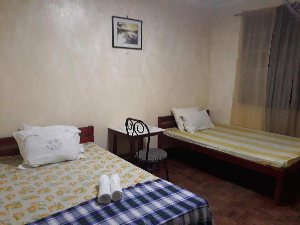 Postel nebo postele na pokoji v ubytování cv bed n bath san juan