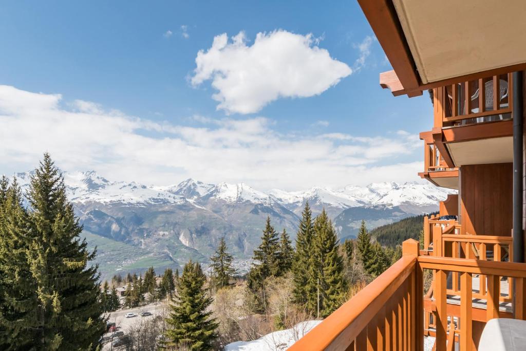 a view from the balcony of a resort with snow covered mountains at Résidence Pierre &amp; Vacances Premium Les Alpages de Chantel in Arc 1800