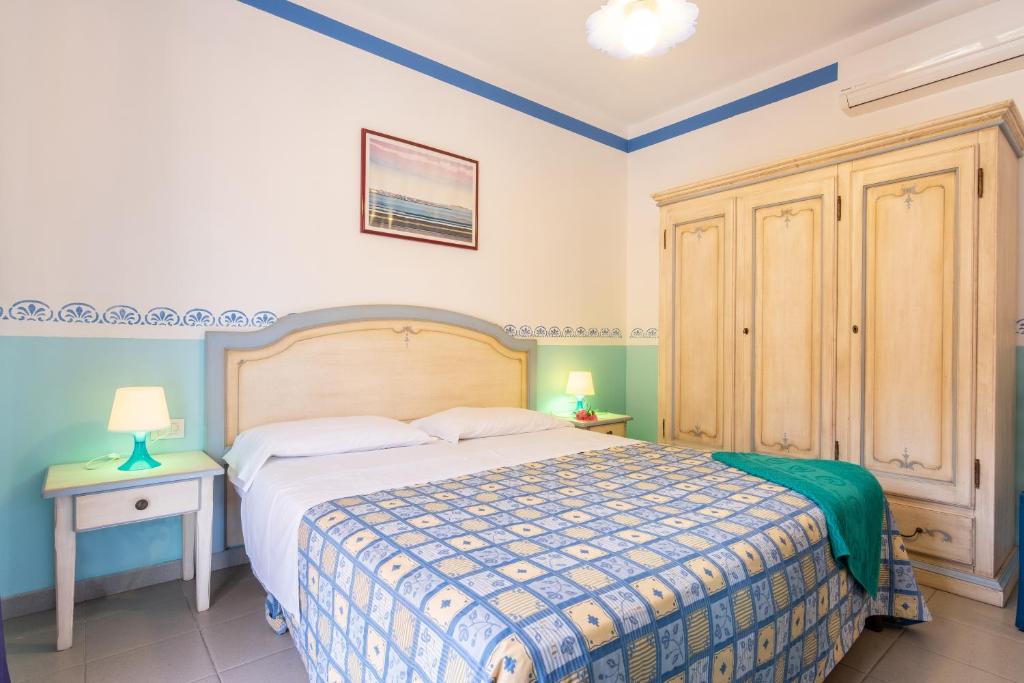 Postel nebo postele na pokoji v ubytování TH Ortano - Ortano Mare Residence