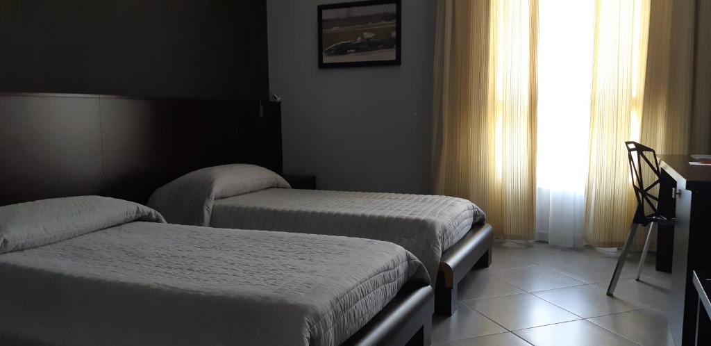Postel nebo postele na pokoji v ubytování Hotel Saturday