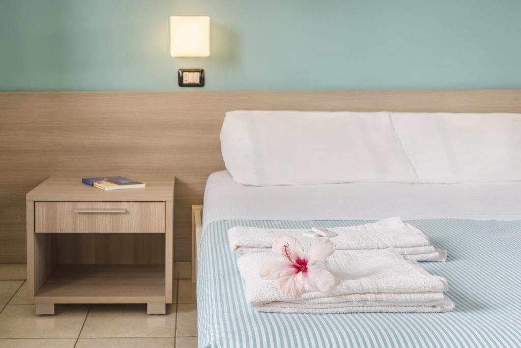 Posteľ alebo postele v izbe v ubytovaní Hotel dei Bizantini & Villaggio Campo dei Messapi