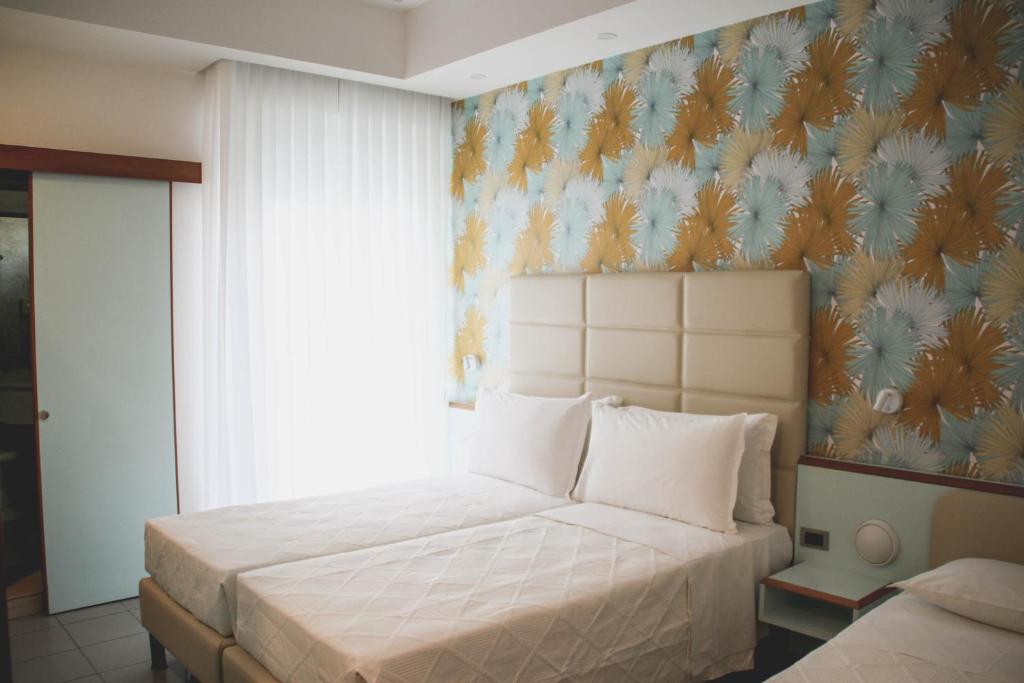 Postel nebo postele na pokoji v ubytování Hotel Gaby