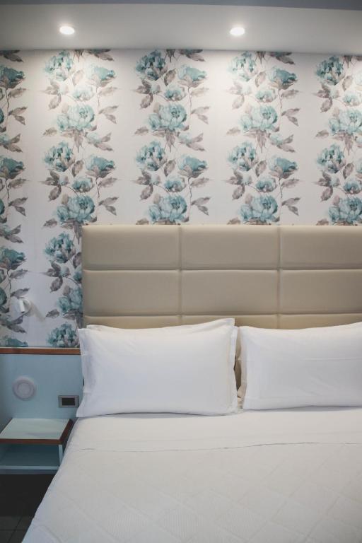 Postel nebo postele na pokoji v ubytování Hotel Gaby