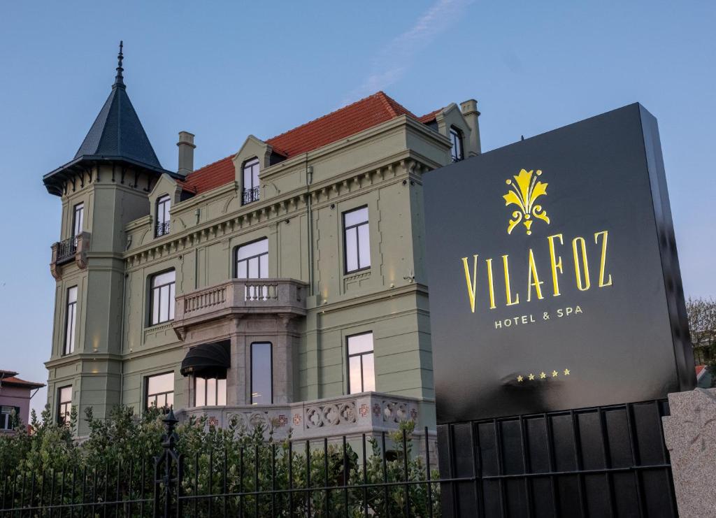 a building with a sign in front of it at Vila Foz Hotel & SPA - member of Design Hotels in Porto