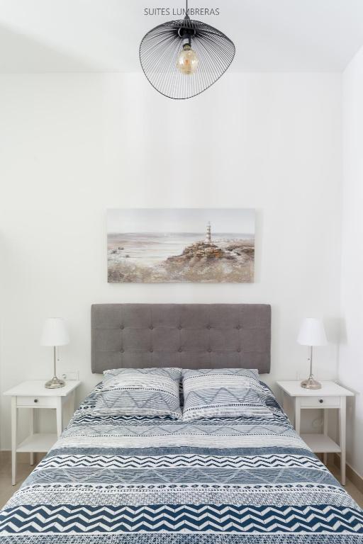 Postel nebo postele na pokoji v ubytování Suites Lumbreras