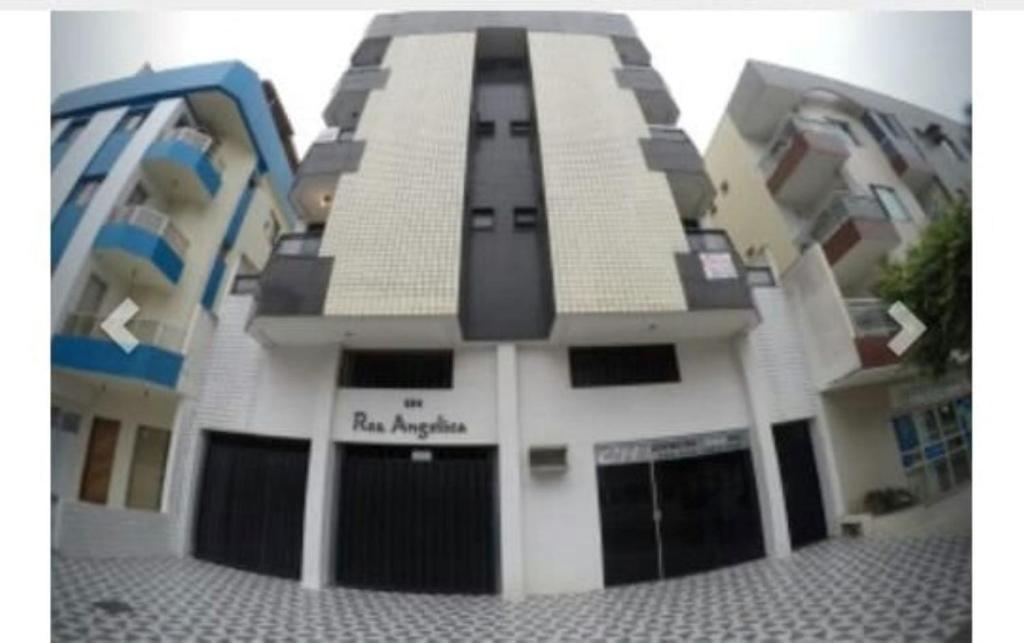un edificio lego con las palabras academia de fuego en él en Apartamento Residencial Angélica em Guarapari a 150m do mar, en Guarapari