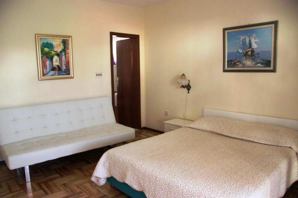 Ένα ή περισσότερα κρεβάτια σε δωμάτιο στο Apartments Iva
