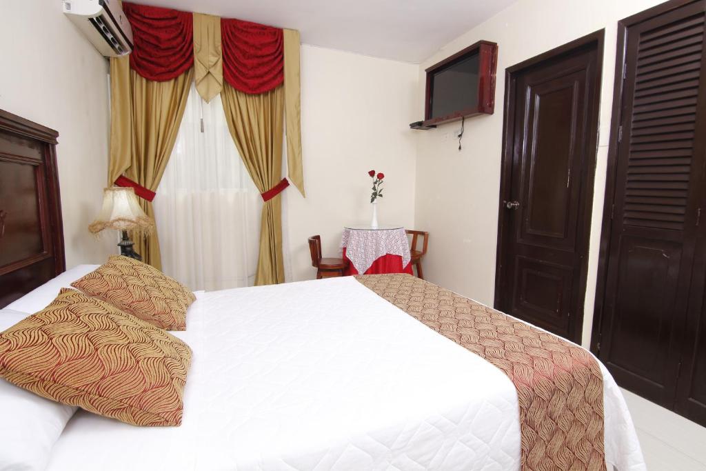 Postel nebo postele na pokoji v ubytování Hotel Flor de Liz