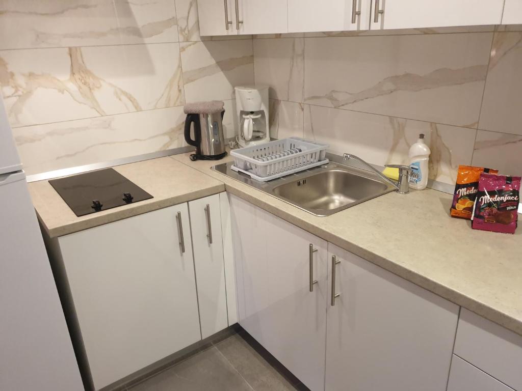 Kuchyňa alebo kuchynka v ubytovaní Mar e Sol Apartments