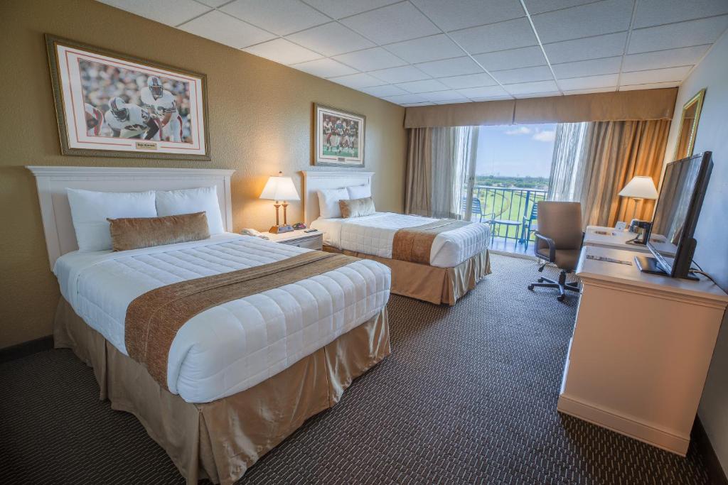 Postel nebo postele na pokoji v ubytování Stadium Hotel