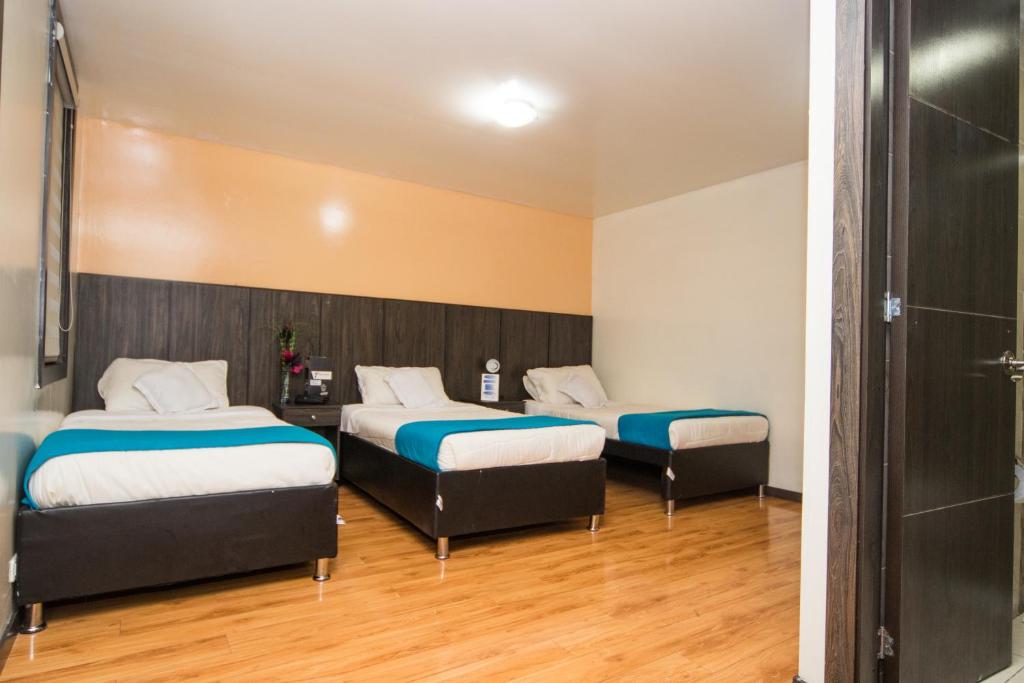 Postel nebo postele na pokoji v ubytování Stay Blue Hotel