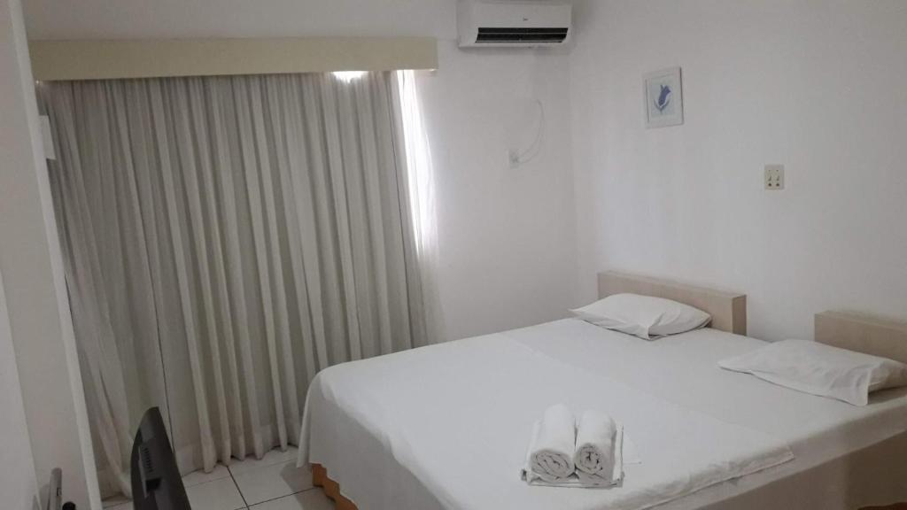 Postel nebo postele na pokoji v ubytování Silva Hospedagem FLAT BELLAGIO BEIRA MAR