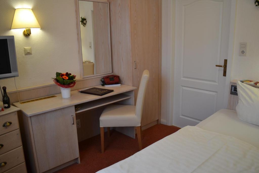 Postel nebo postele na pokoji v ubytování Hotel Hansa