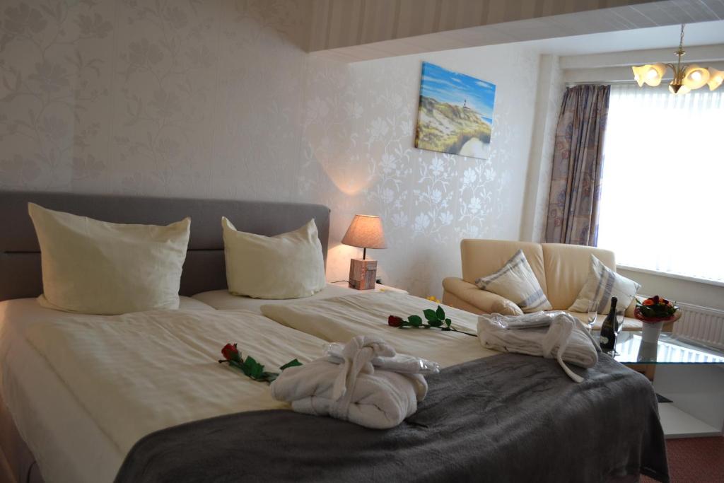 Postel nebo postele na pokoji v ubytování Hotel Hansa