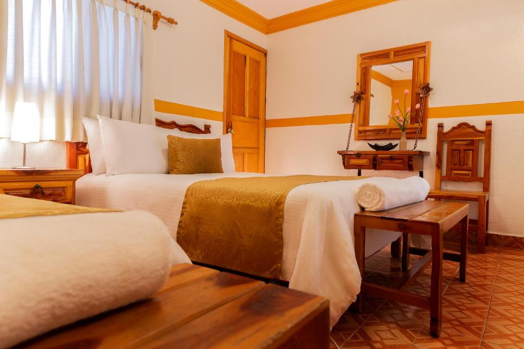 Postel nebo postele na pokoji v ubytování Casablanca Hotel Tula