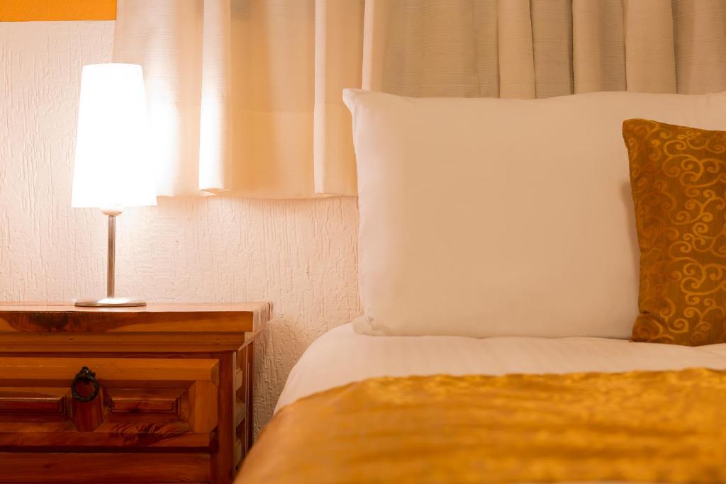 Postel nebo postele na pokoji v ubytování Casablanca Hotel Tula