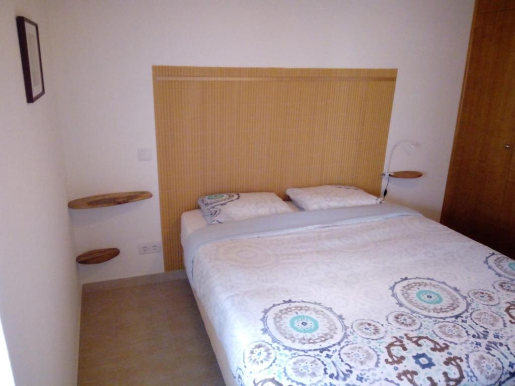 Postel nebo postele na pokoji v ubytování O Nosso Lar
