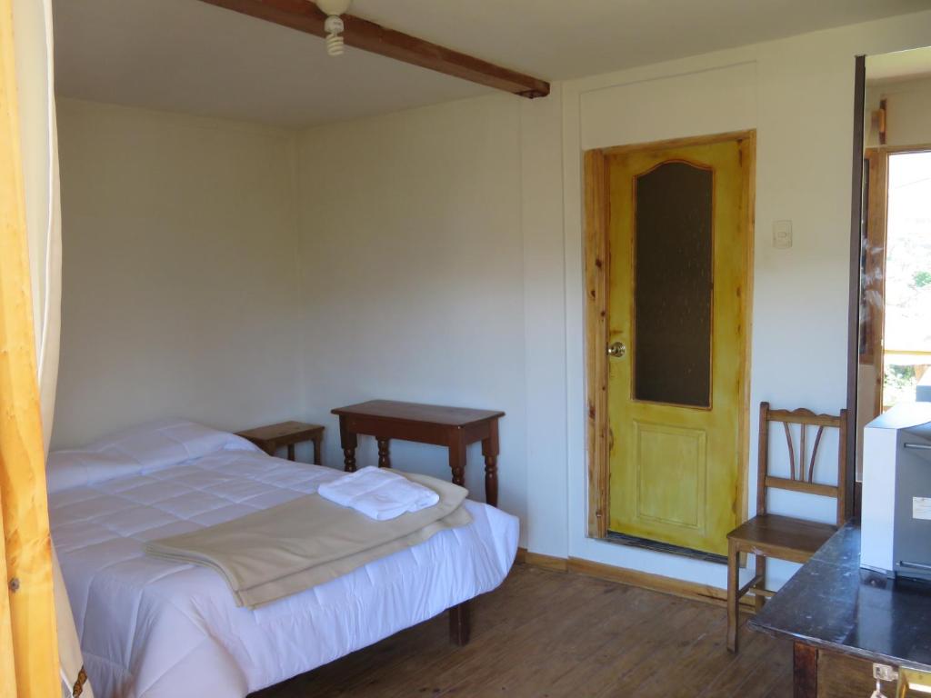 Postel nebo postele na pokoji v ubytování Schatzi Lodge