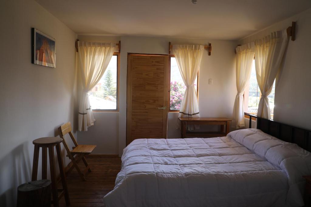 Postel nebo postele na pokoji v ubytování Schatzi Lodge