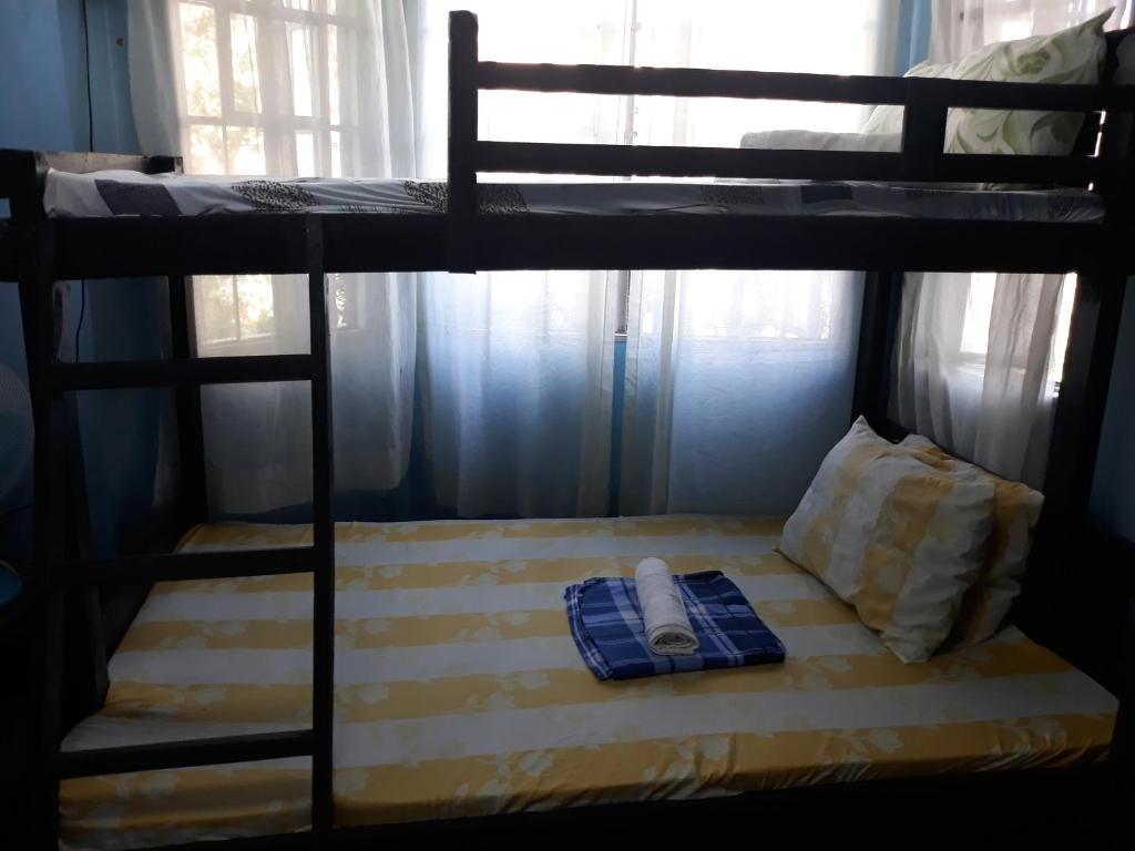 Postel nebo postele na pokoji v ubytování cv bed n bath san juan