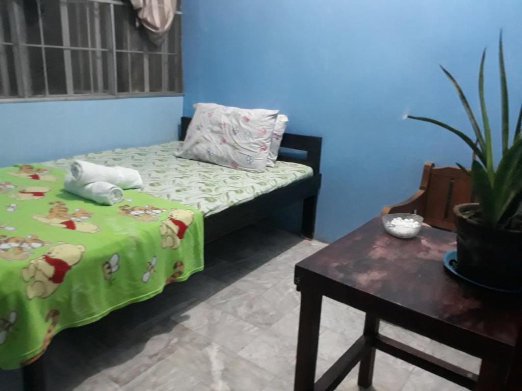 Postel nebo postele na pokoji v ubytování cv bed n bath san juan