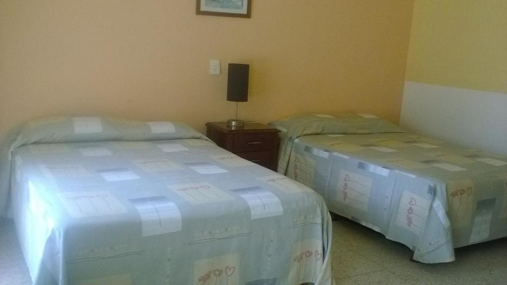 Postel nebo postele na pokoji v ubytování Hotel Playa Azul
