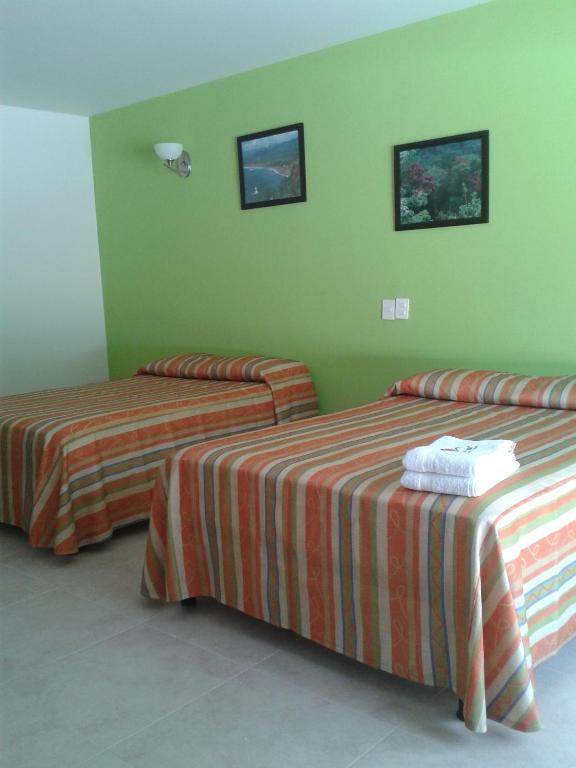 Postel nebo postele na pokoji v ubytování Hotel Playa Azul