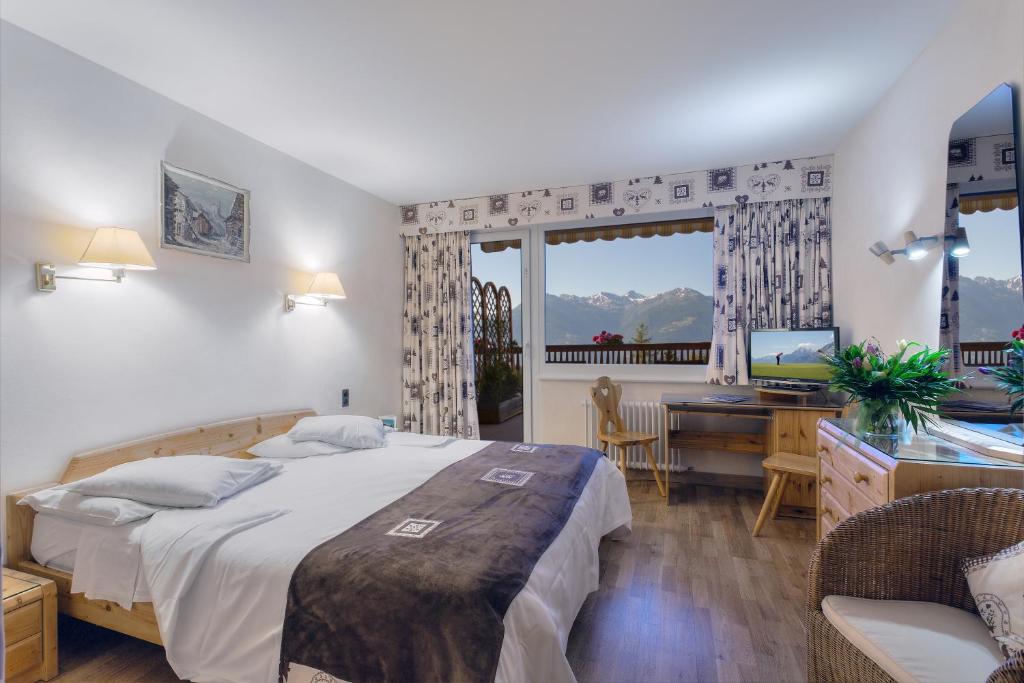 Postel nebo postele na pokoji v ubytování Hotel Ad'Eldorado