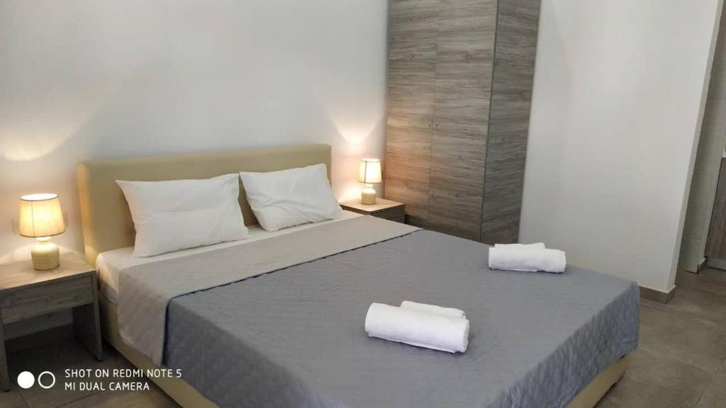 Postel nebo postele na pokoji v ubytování STRAWBERRY Skiathos