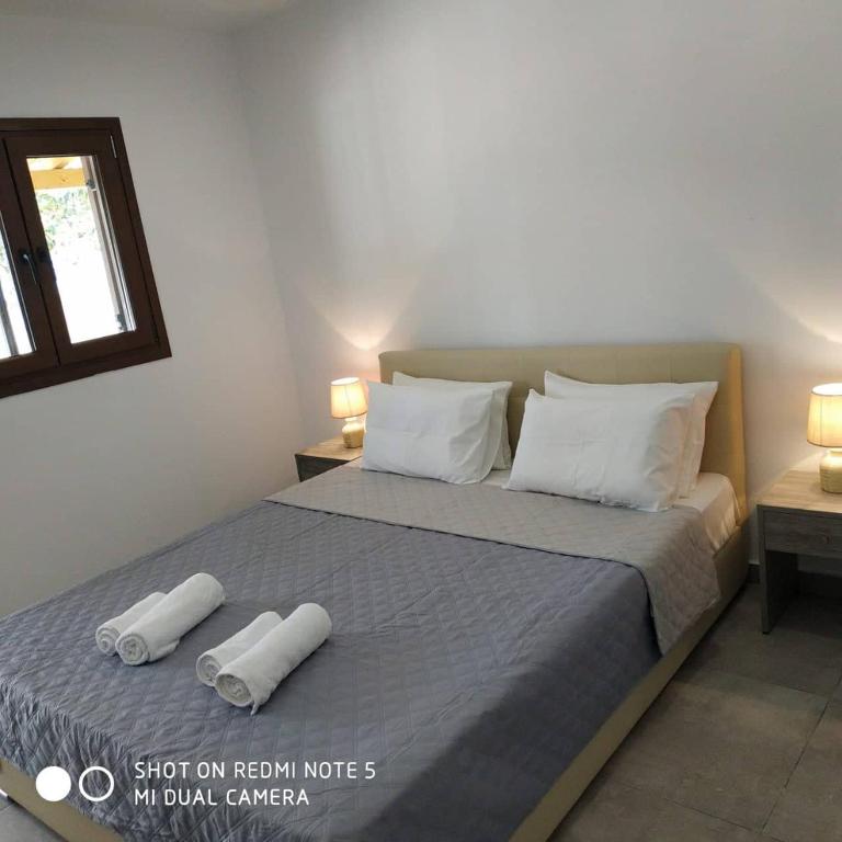 Postel nebo postele na pokoji v ubytování STRAWBERRY Skiathos
