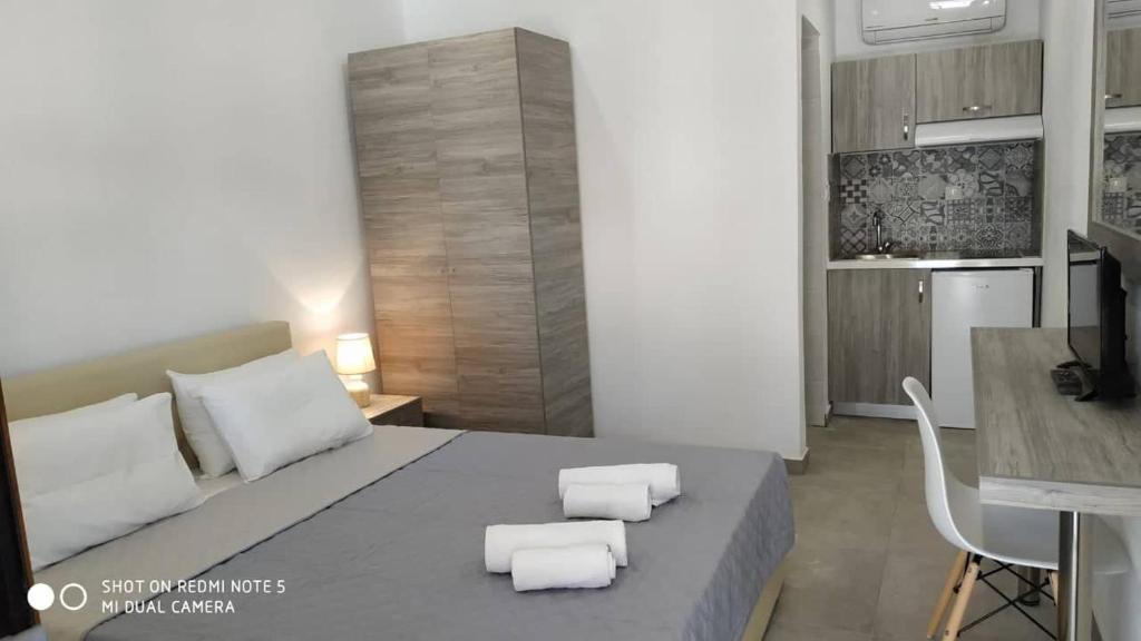 Postel nebo postele na pokoji v ubytování STRAWBERRY Skiathos